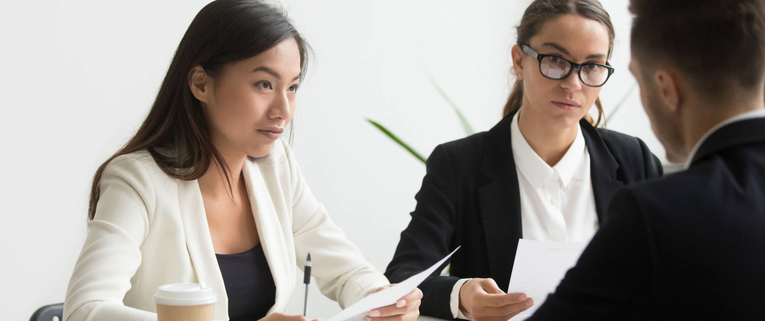 Colleagues discussing business plan in office