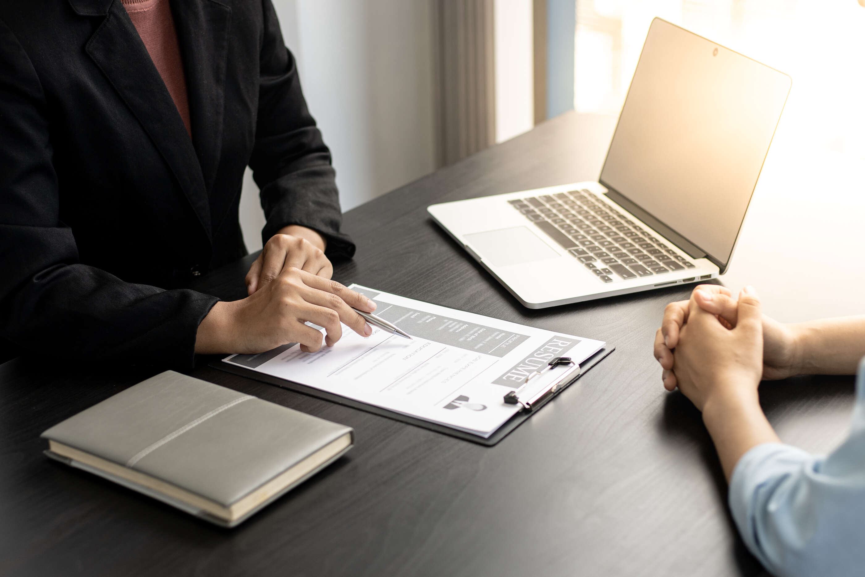 employer-hr-department-is-reading-resume-interviewing-ability-new-employees